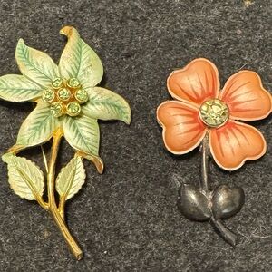 Two vintage FLOWER BROOCHES. One green and one coral-pink color